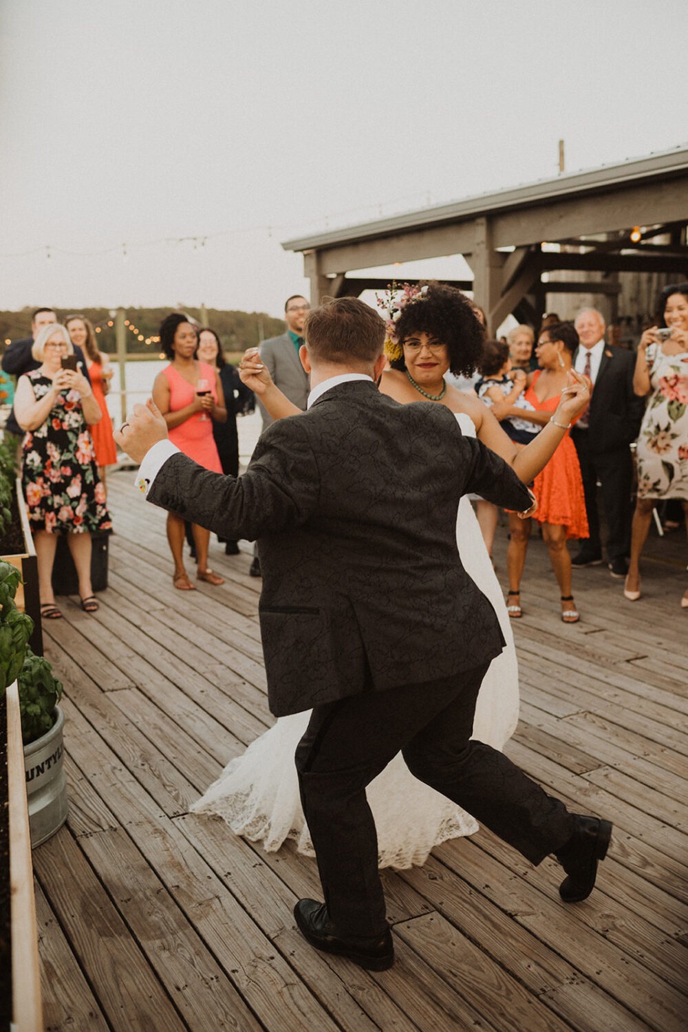 couple dances together at summer wedding reception