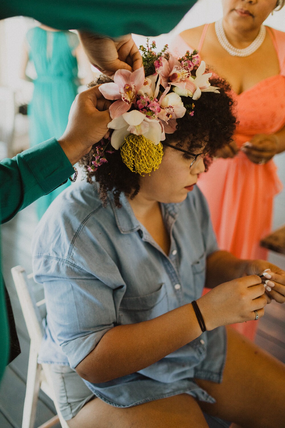 bride wears tropical flowers in her hair
