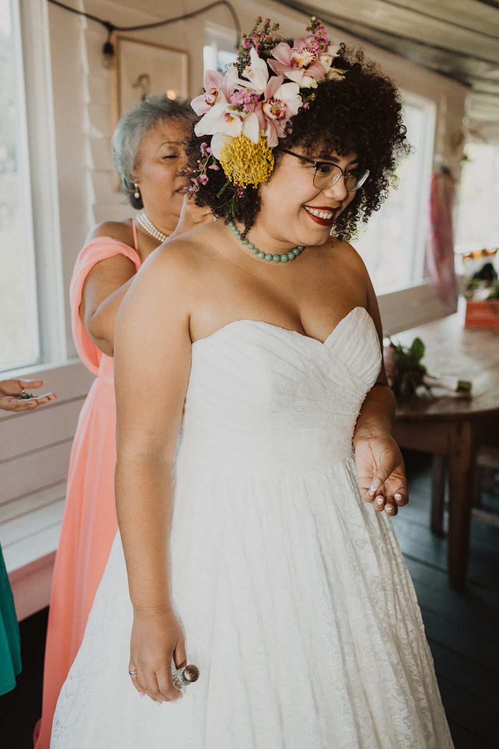 bride wears tropical flowers in her hair