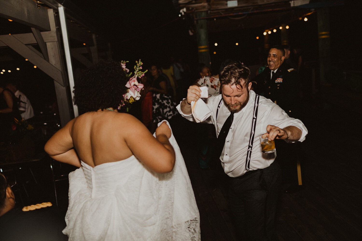 couple dances together at summer wedding