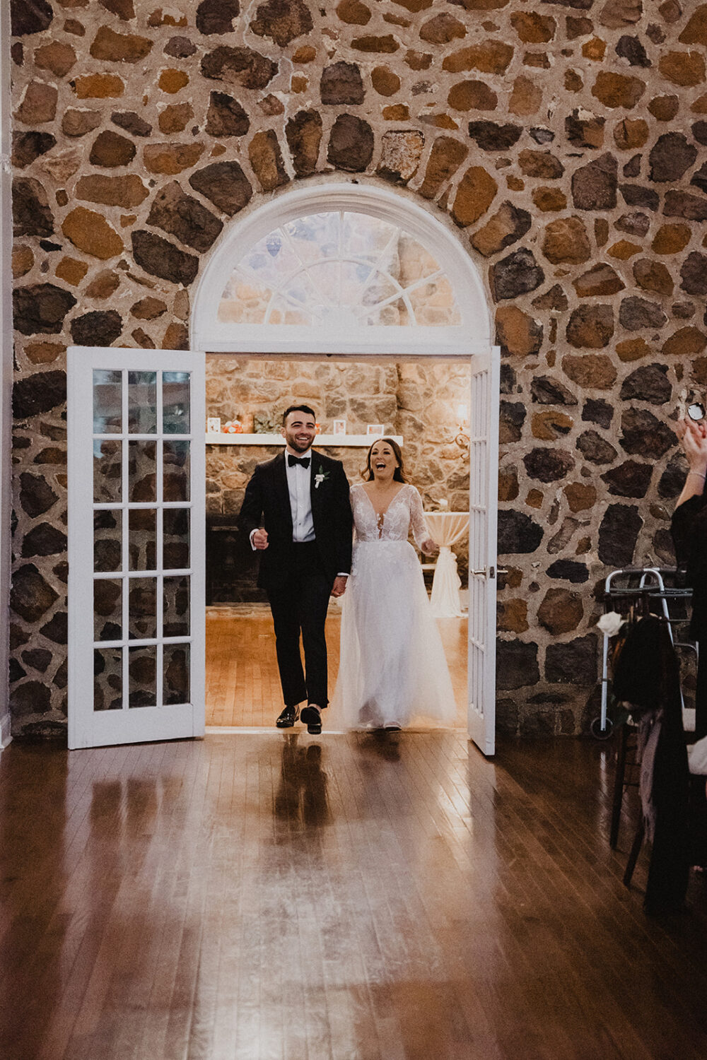 couple enters reception at Virginia wedding venue