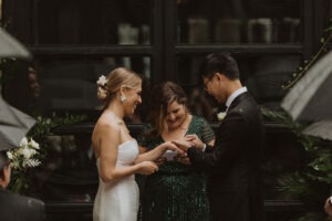 couple exchanges rings during wedding ceremony