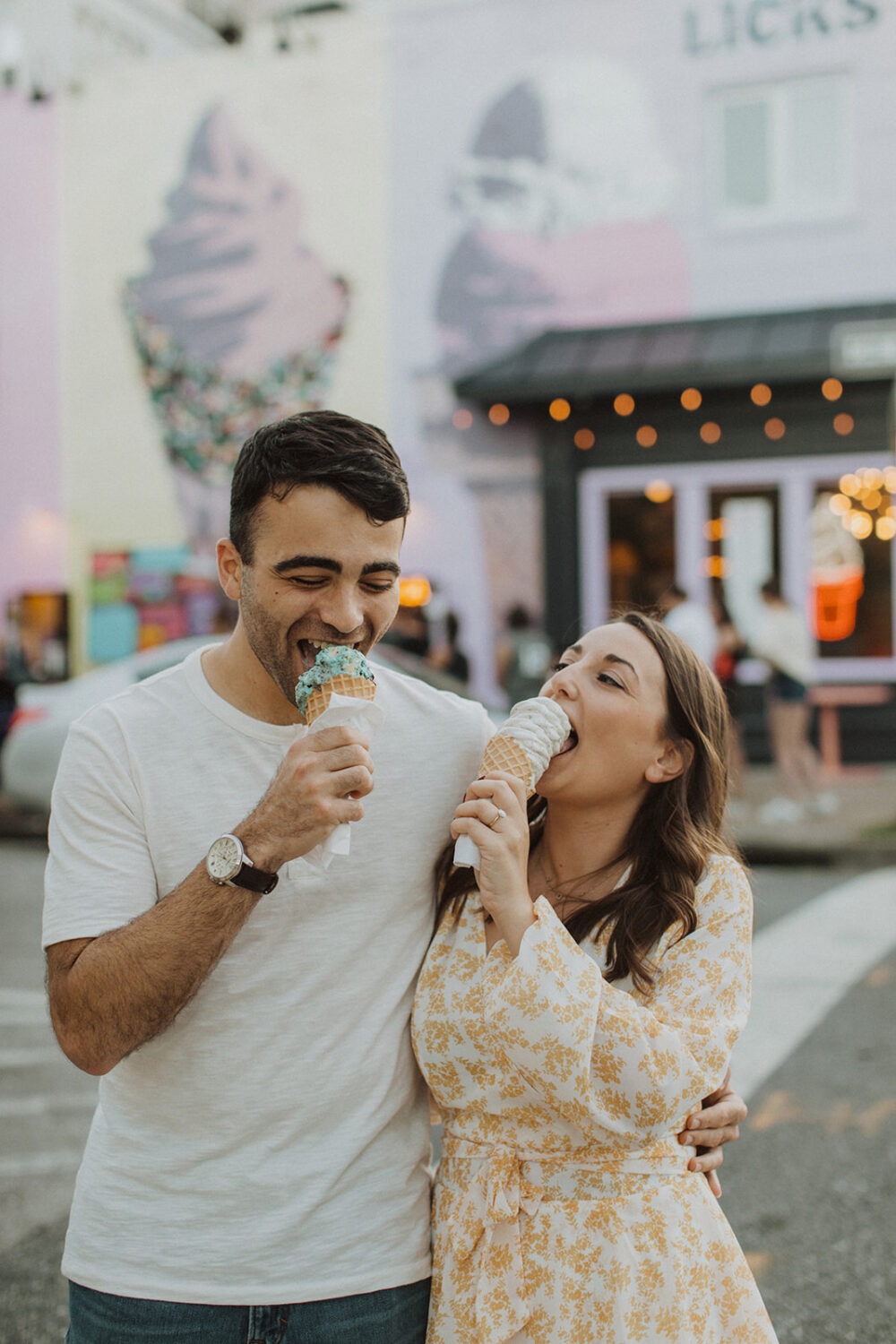 couple eats ice cream cones at Baltimore engagement session