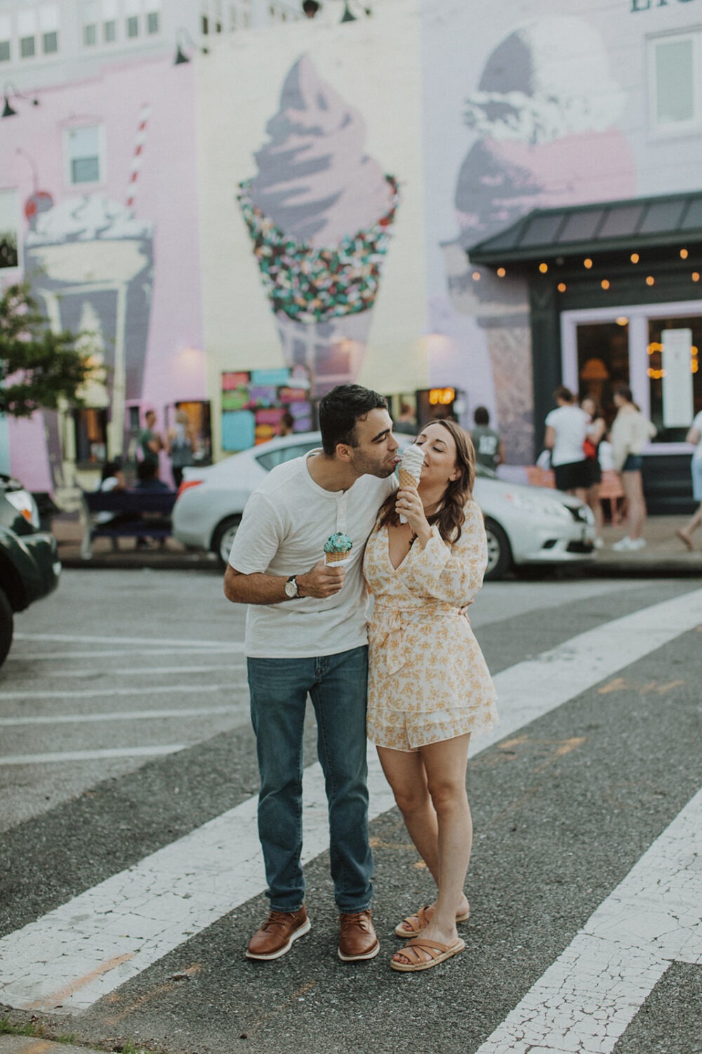 couple eats ice cream cones at Baltimore engagement session
