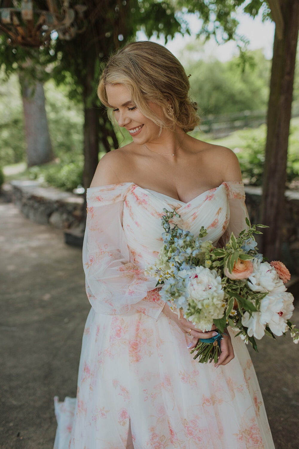 bride holds wildflower wedding bouquet