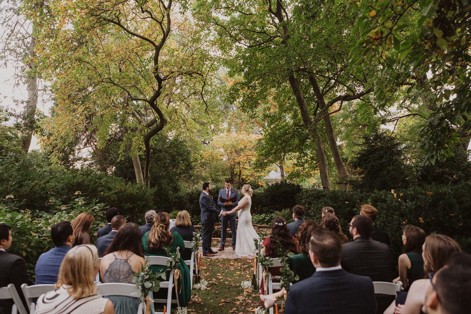 couple exchanges vows during outdoor wedding 
