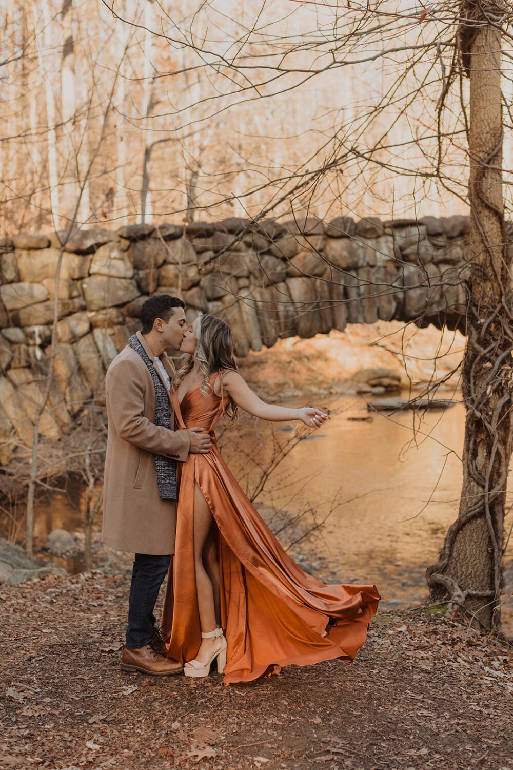 couple dresses up with engagement shoot outfit