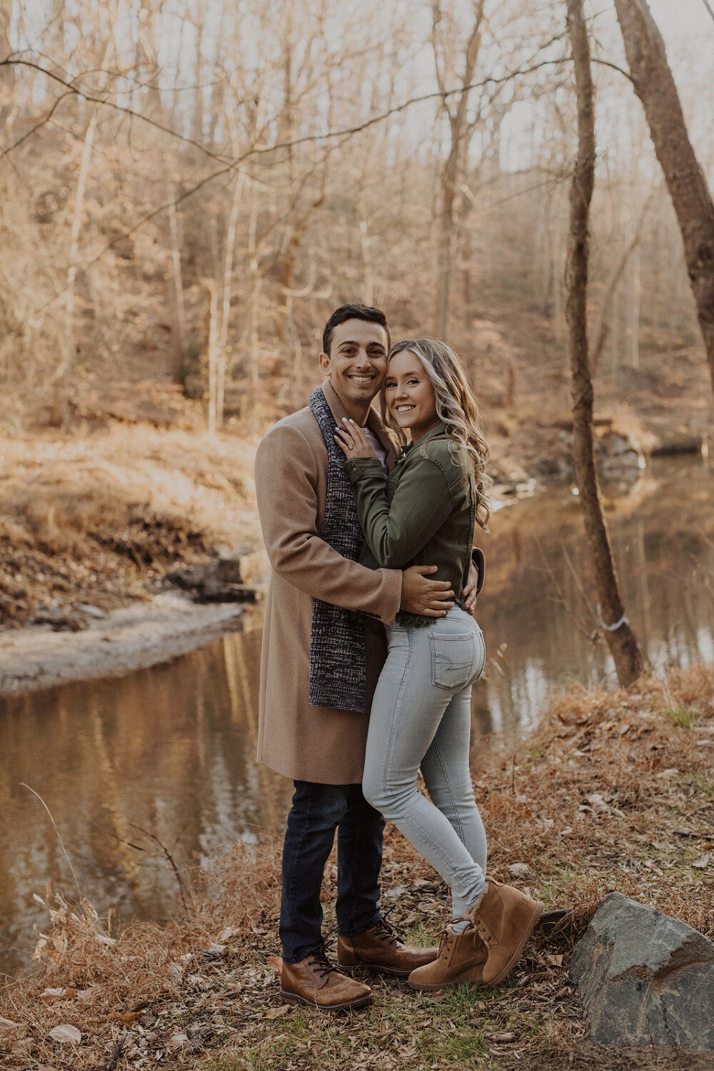 couple embraces at outdoor fall engagement session 