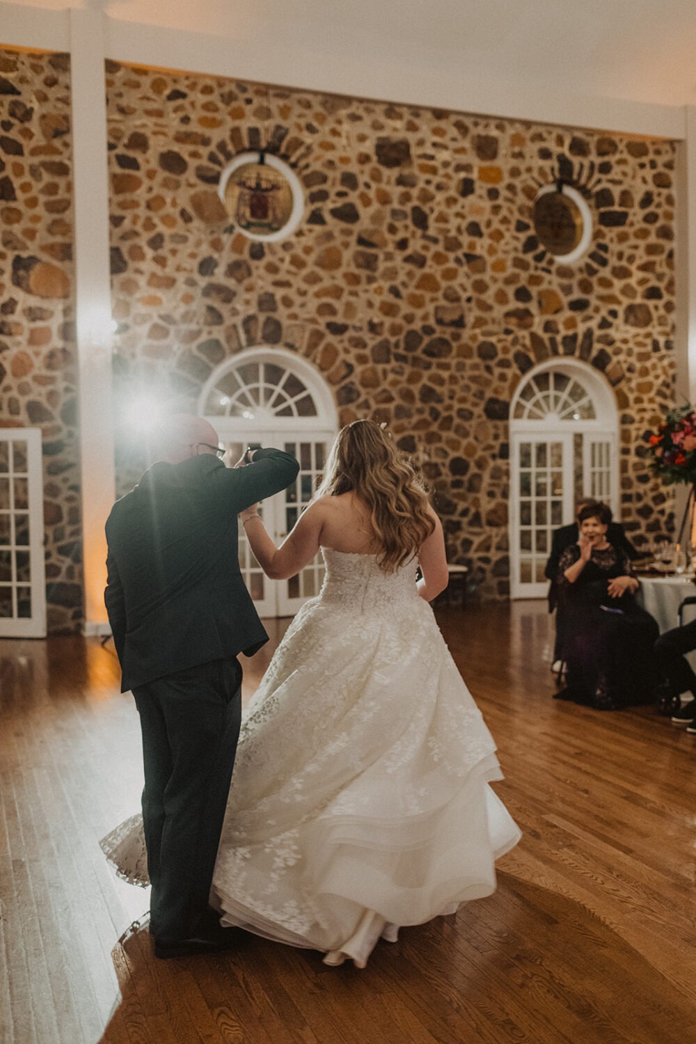 couple dances at wedding reception using wedding planning tips