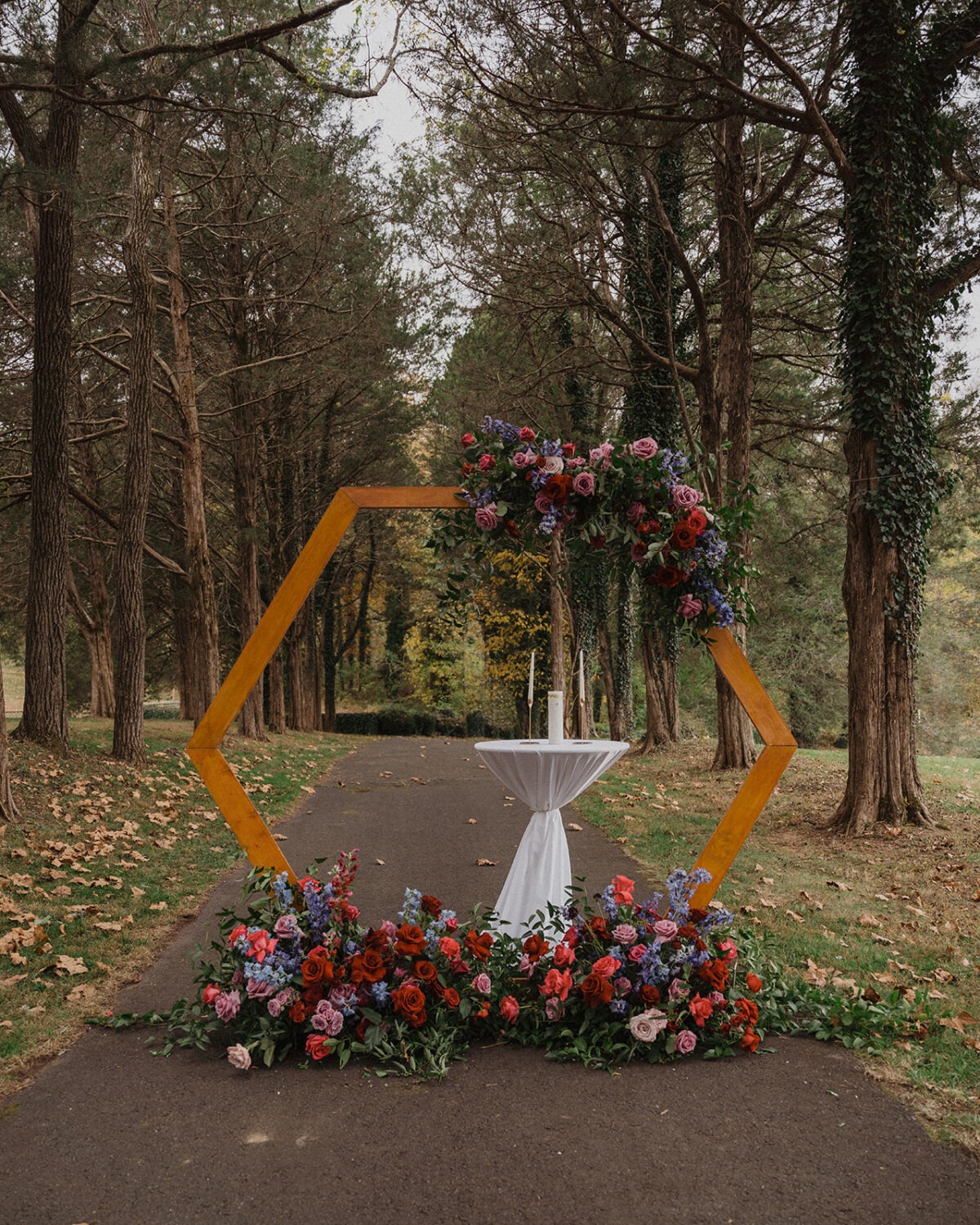 floral decor on arch at wedding ceremony