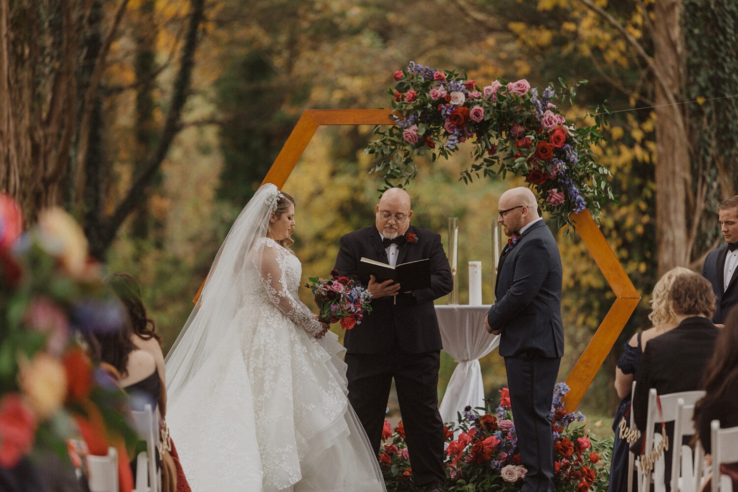 couple exchanges vows at outdoor fall Poplar Springs wedding