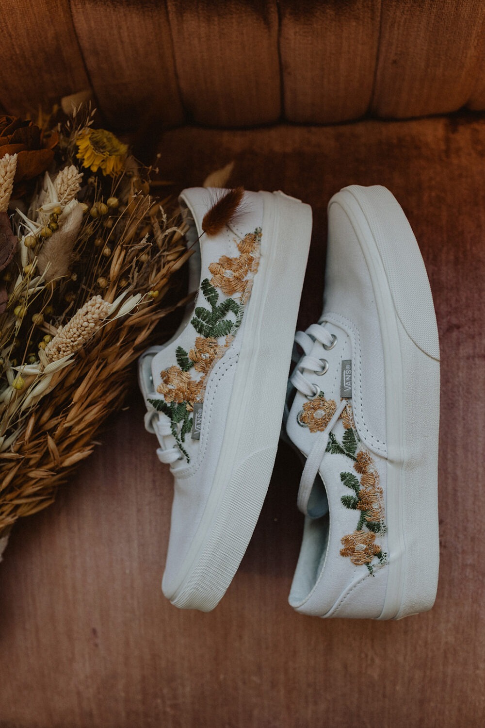 floral details on white wedding shoes