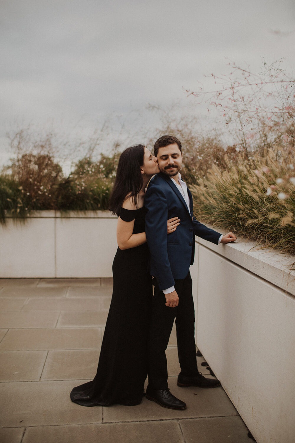 couple embraces at Kennedy Center DC engagement session