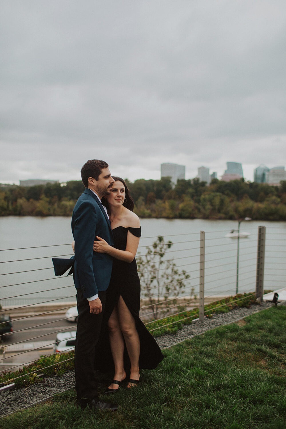 couple embraces at Kennedy Center engagement session