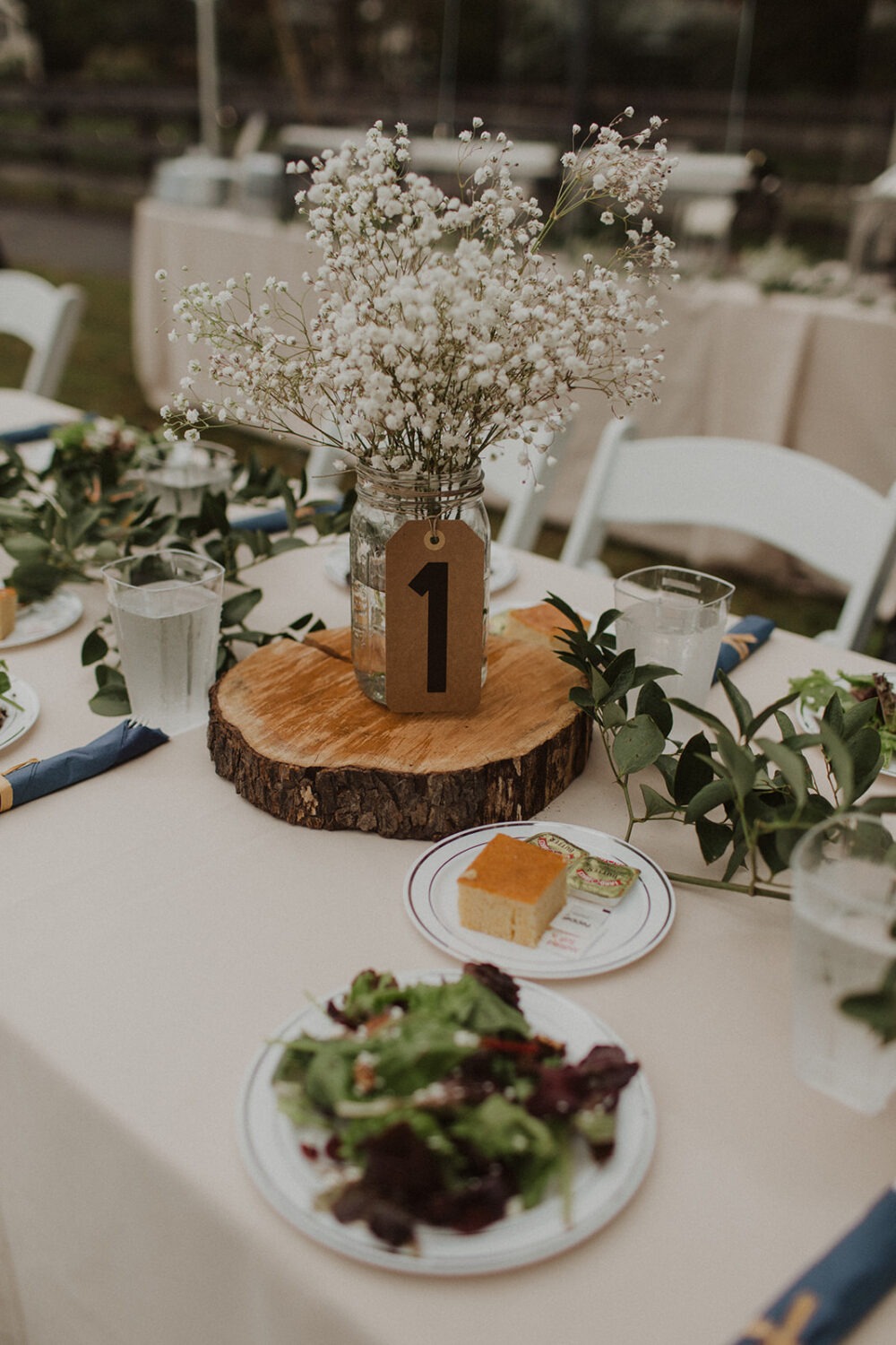 floral and wood table setting at DIY wedding
