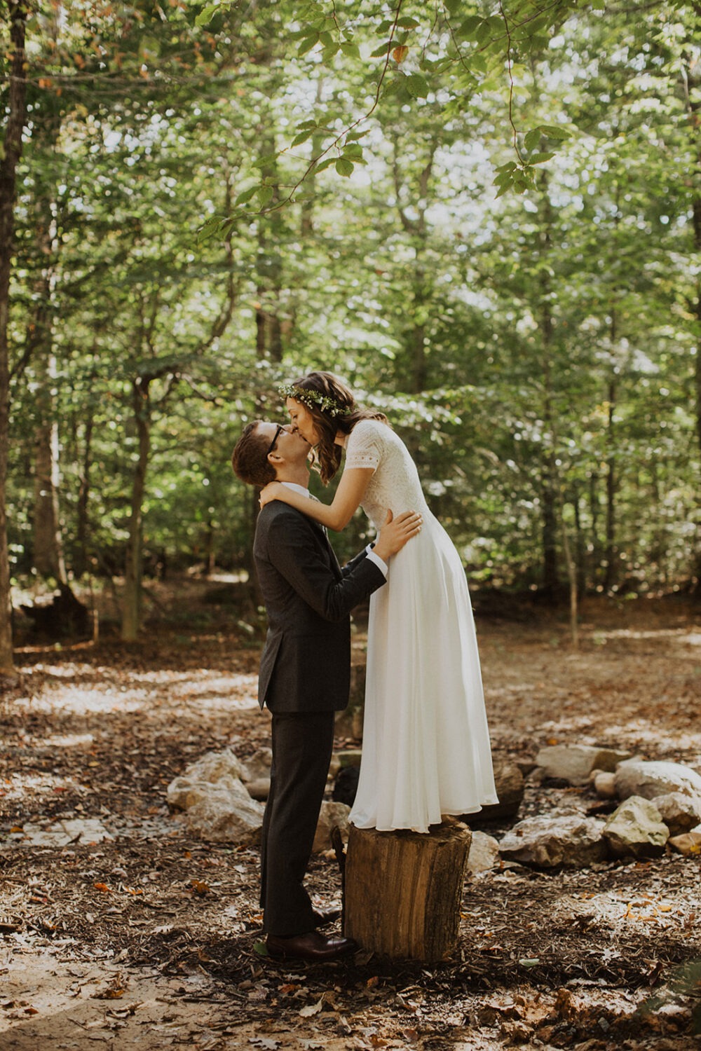 couple kisses in woods at sunset Virginia elopement