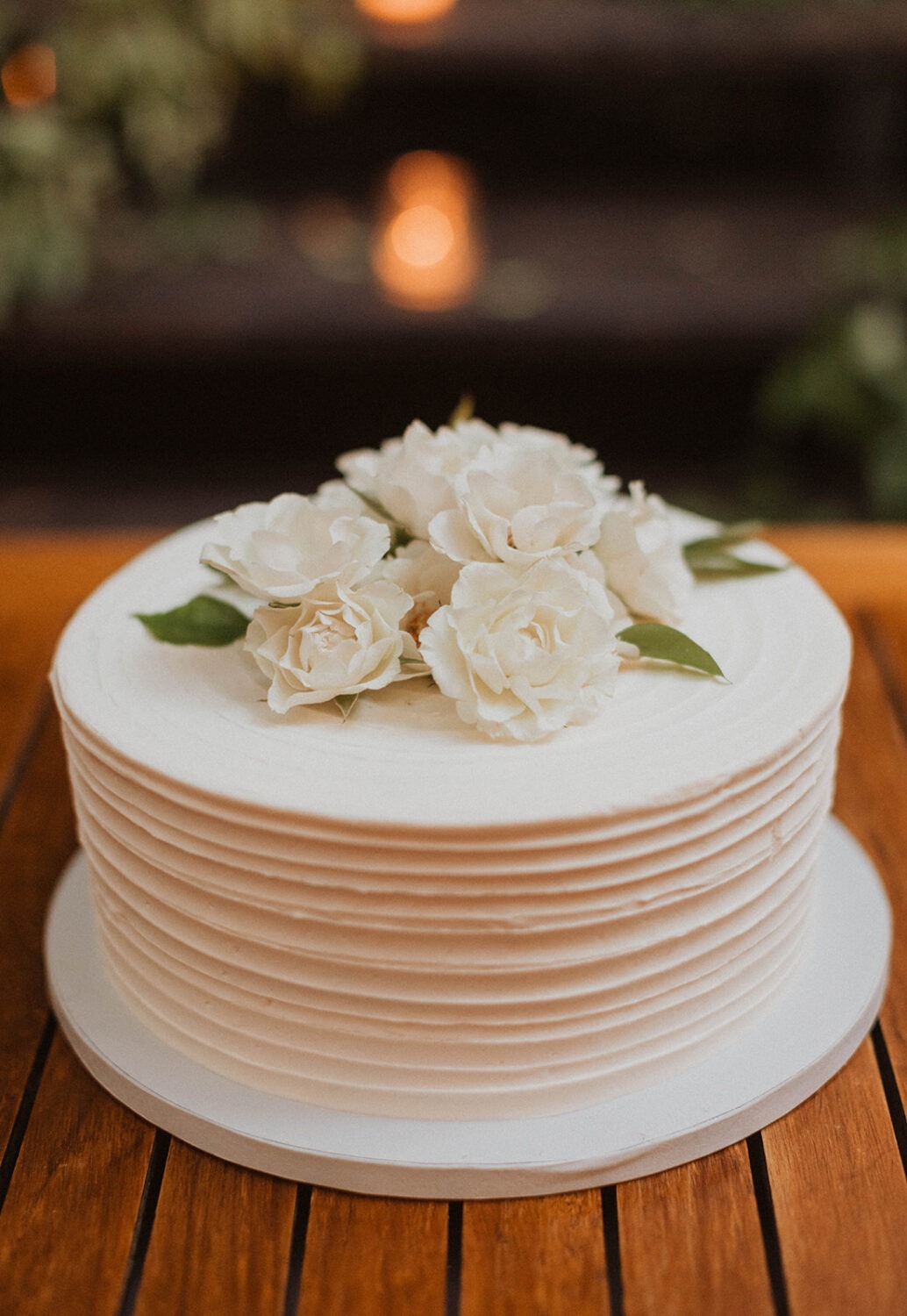 flower-topped wedding cake at Iron Gate Restaurant DC intimate wedding
