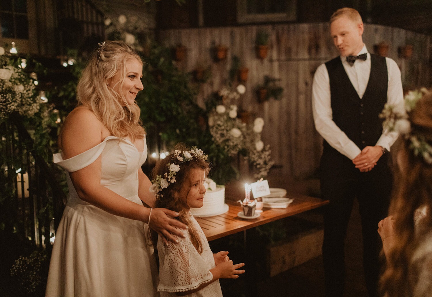 couple stands with flower girl at Iron Gate Restaurant DC intimate wedding