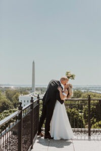 couple kisses on rooftop at Washington DC intimate wedding