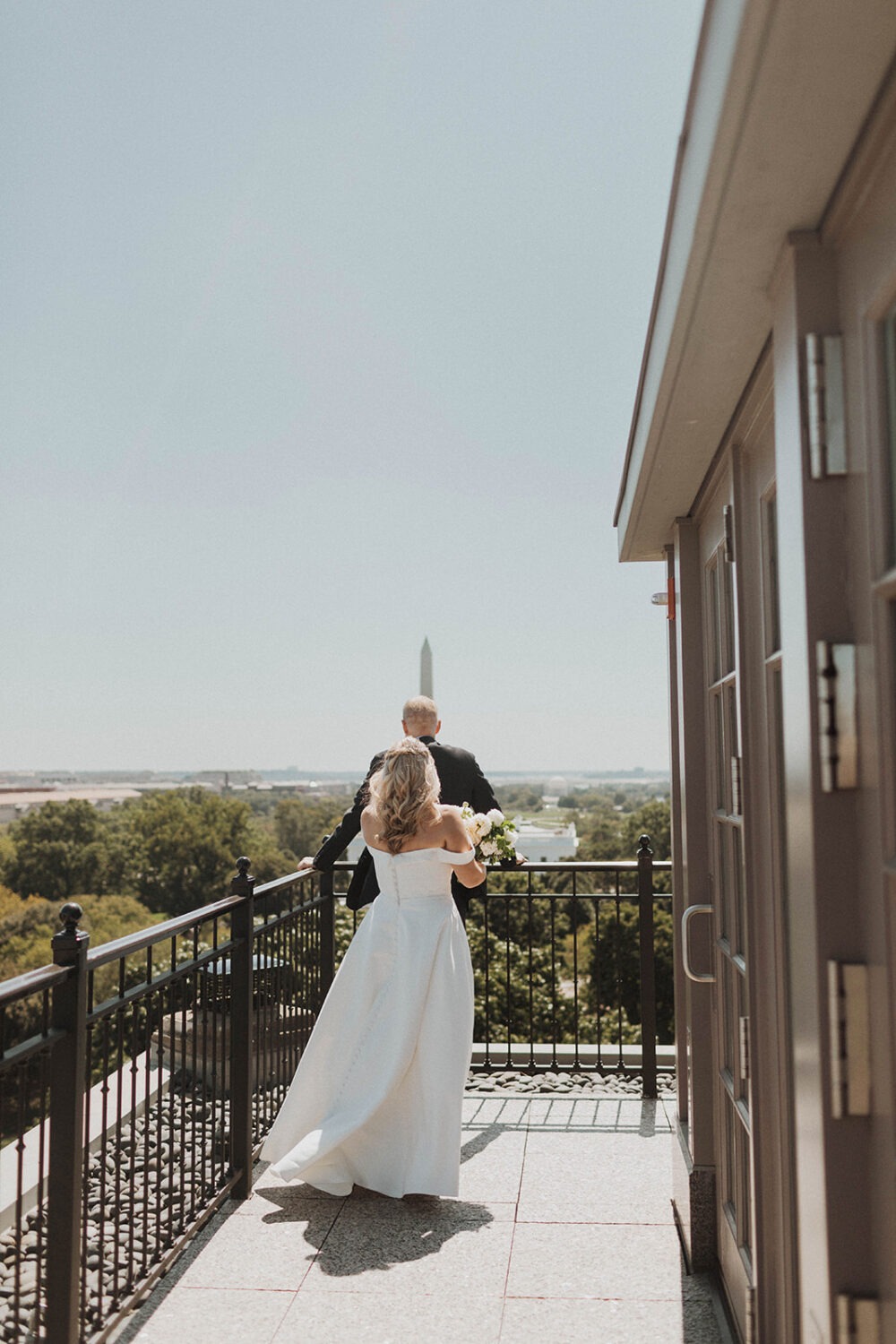 couple has first look on Washington DC rooftop 