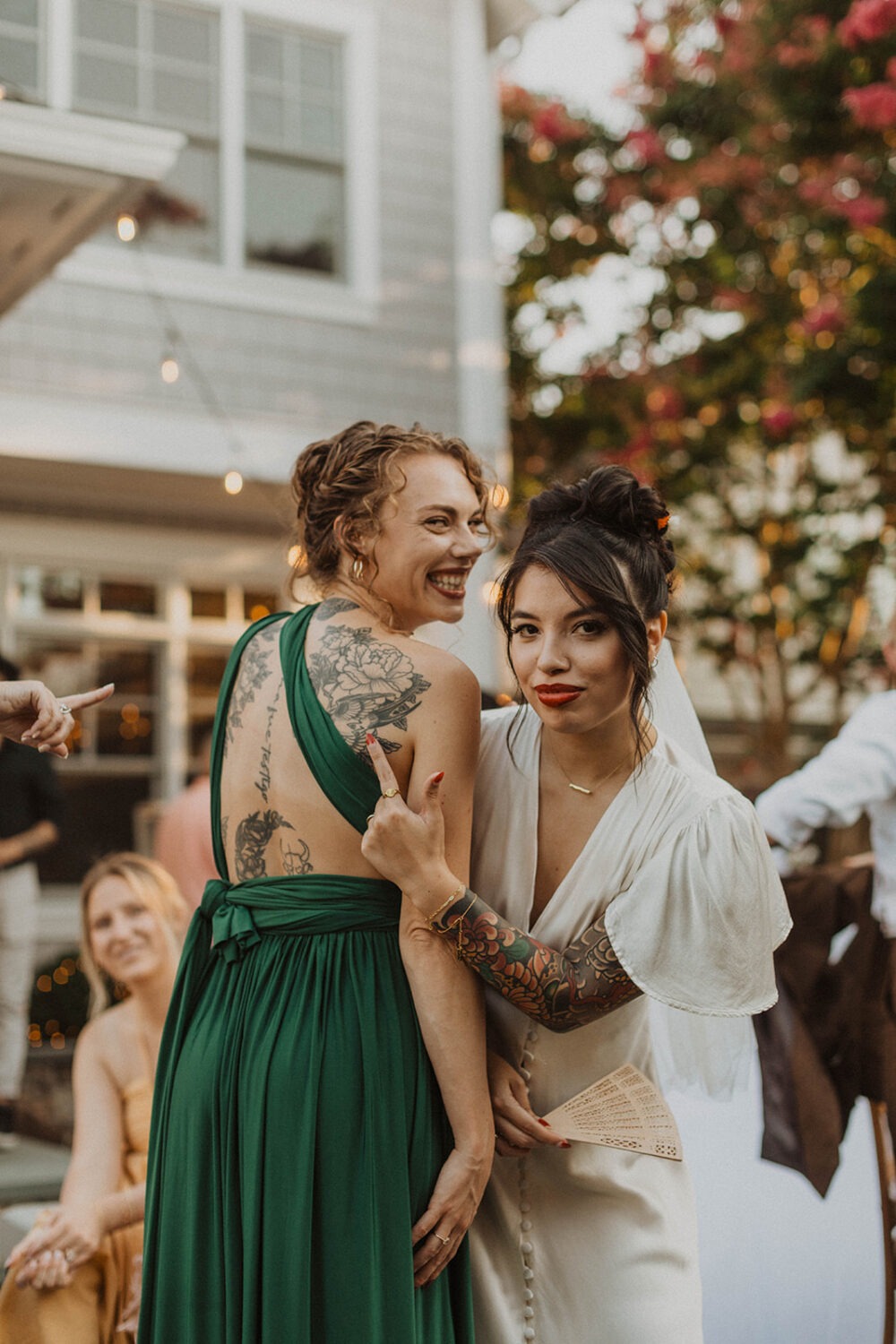bride points to her tattoo art