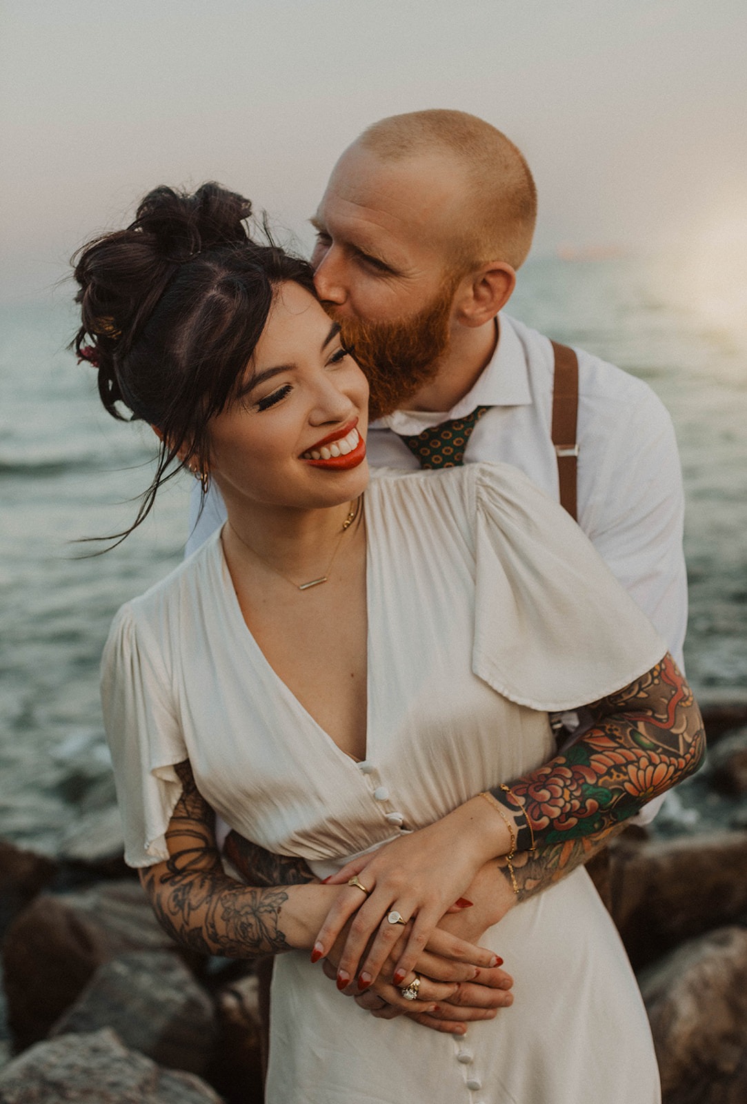 couple embraces at Maryland waterfront wedding