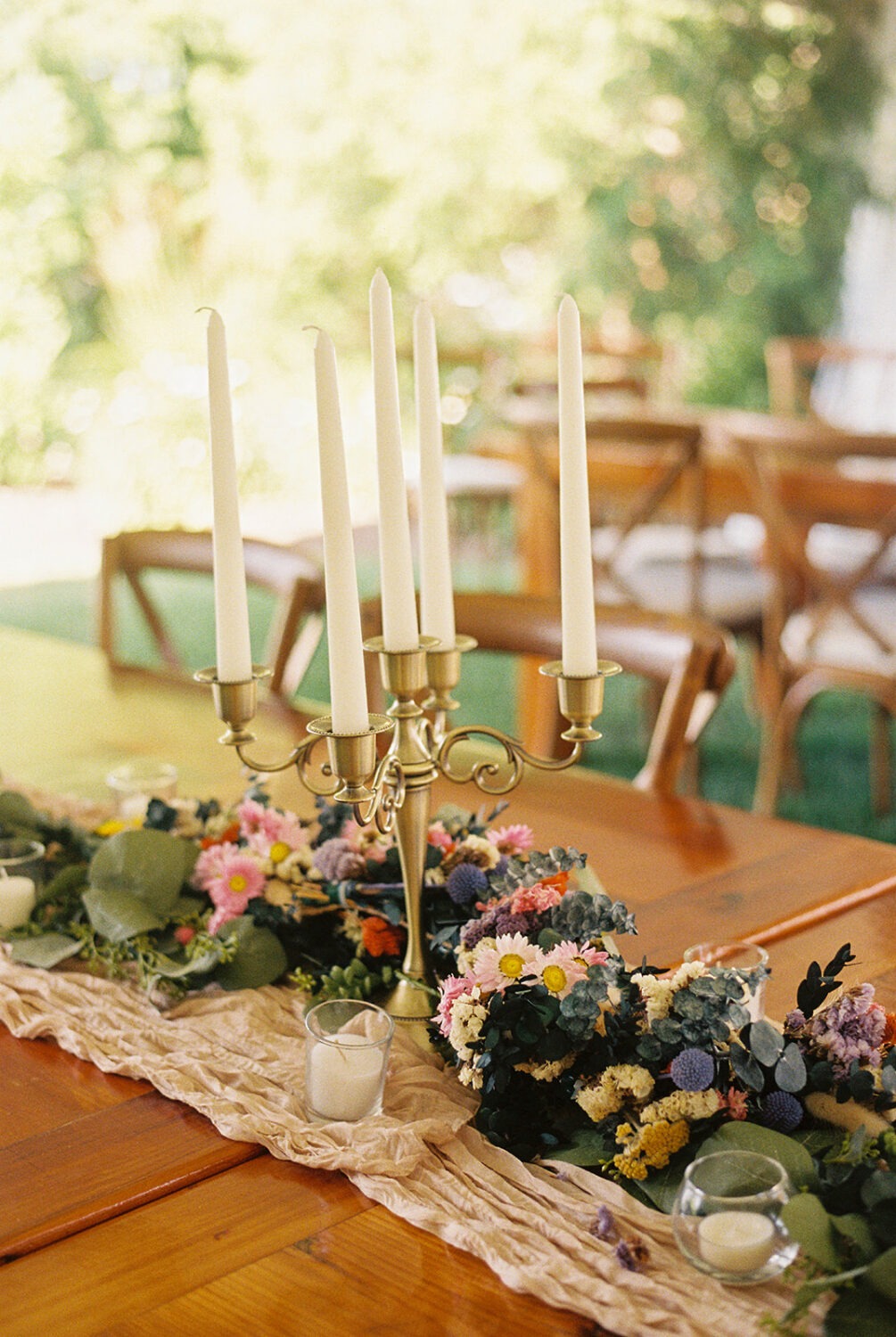 candles and dried wedding florals at wedding reception captured by film wedding photography