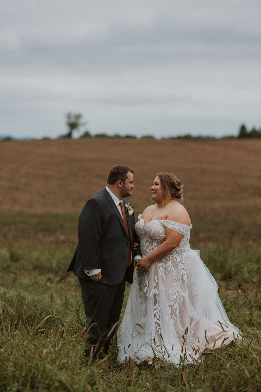couple holds hands through in Maryland farm wedding venue