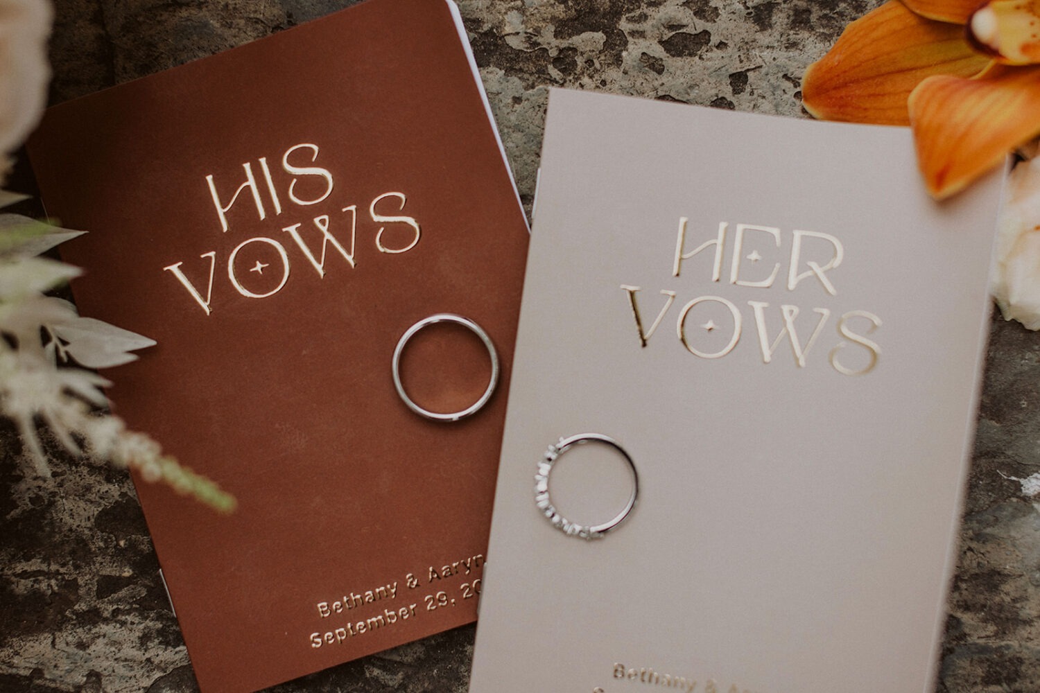 his and her wedding vow books with wedding rings