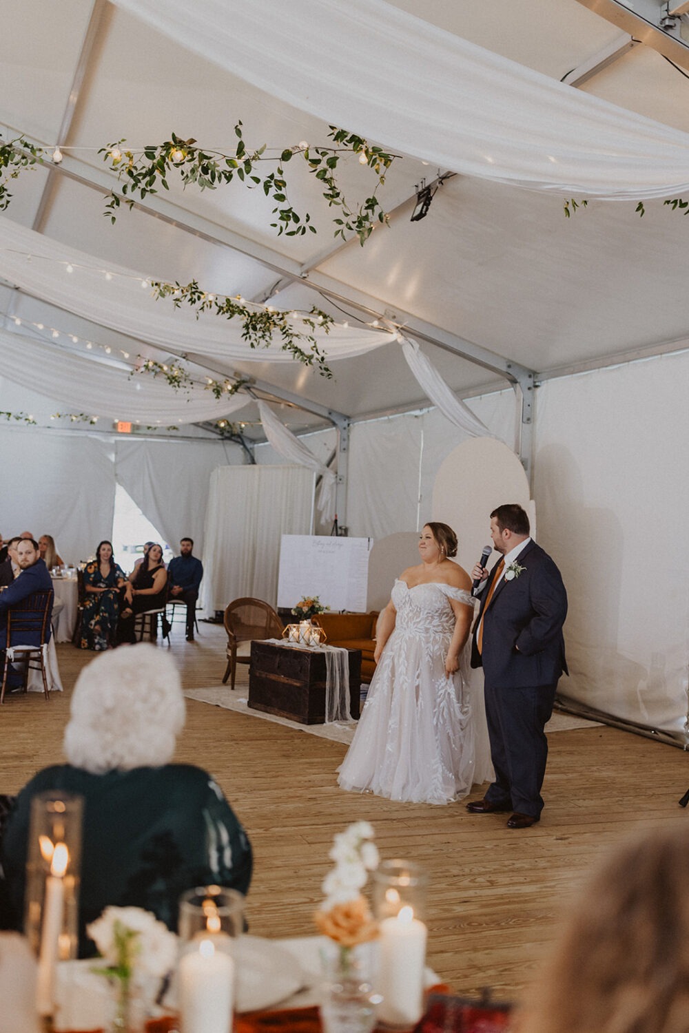 couple makes a speech at wedding reception 