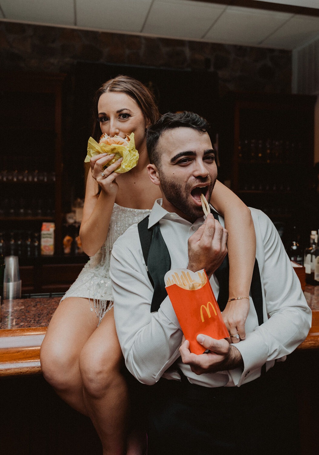 couple eats McDonald's during wedding reception as example of 2024 wedding trends