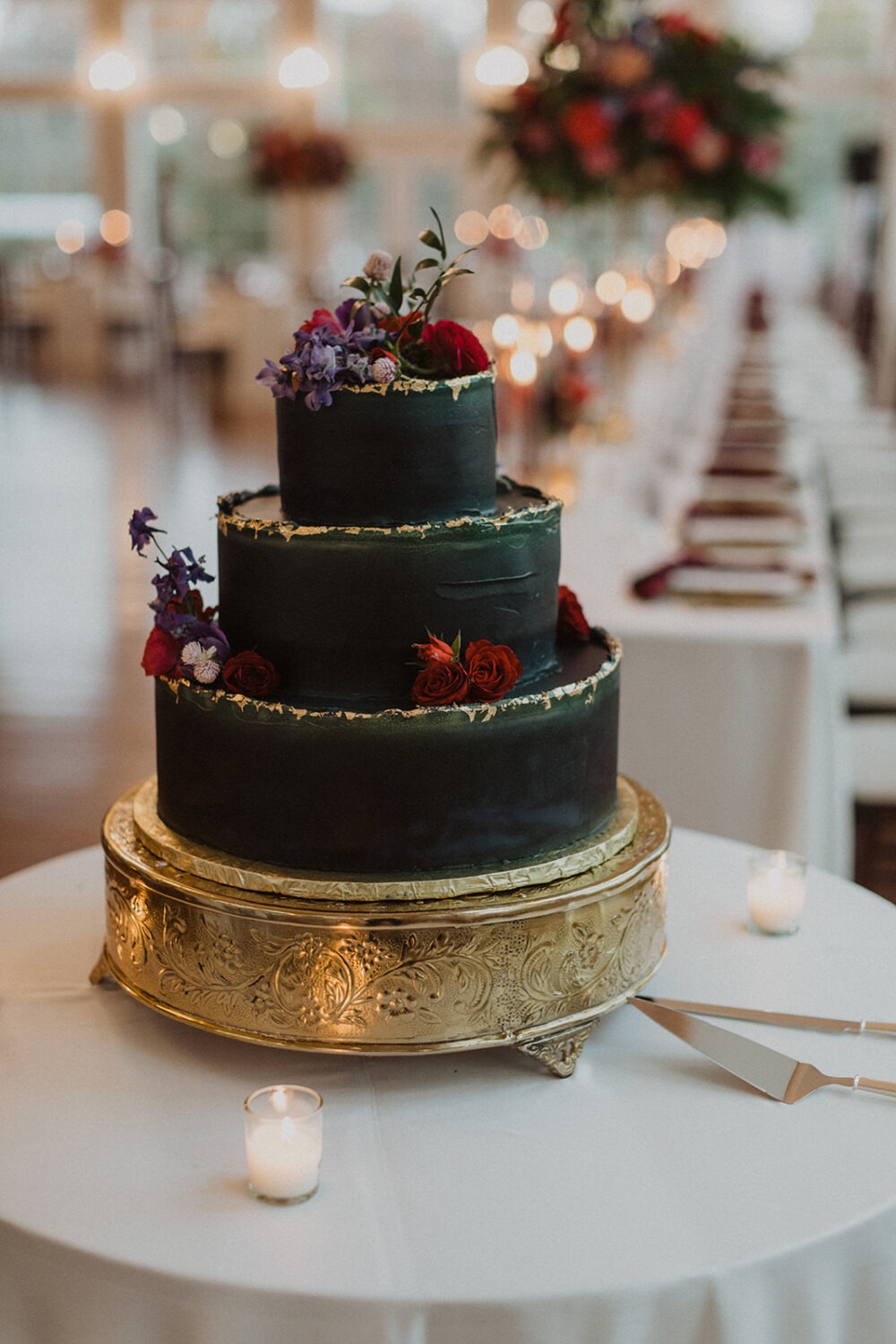 green and gold wedding cake with flowers