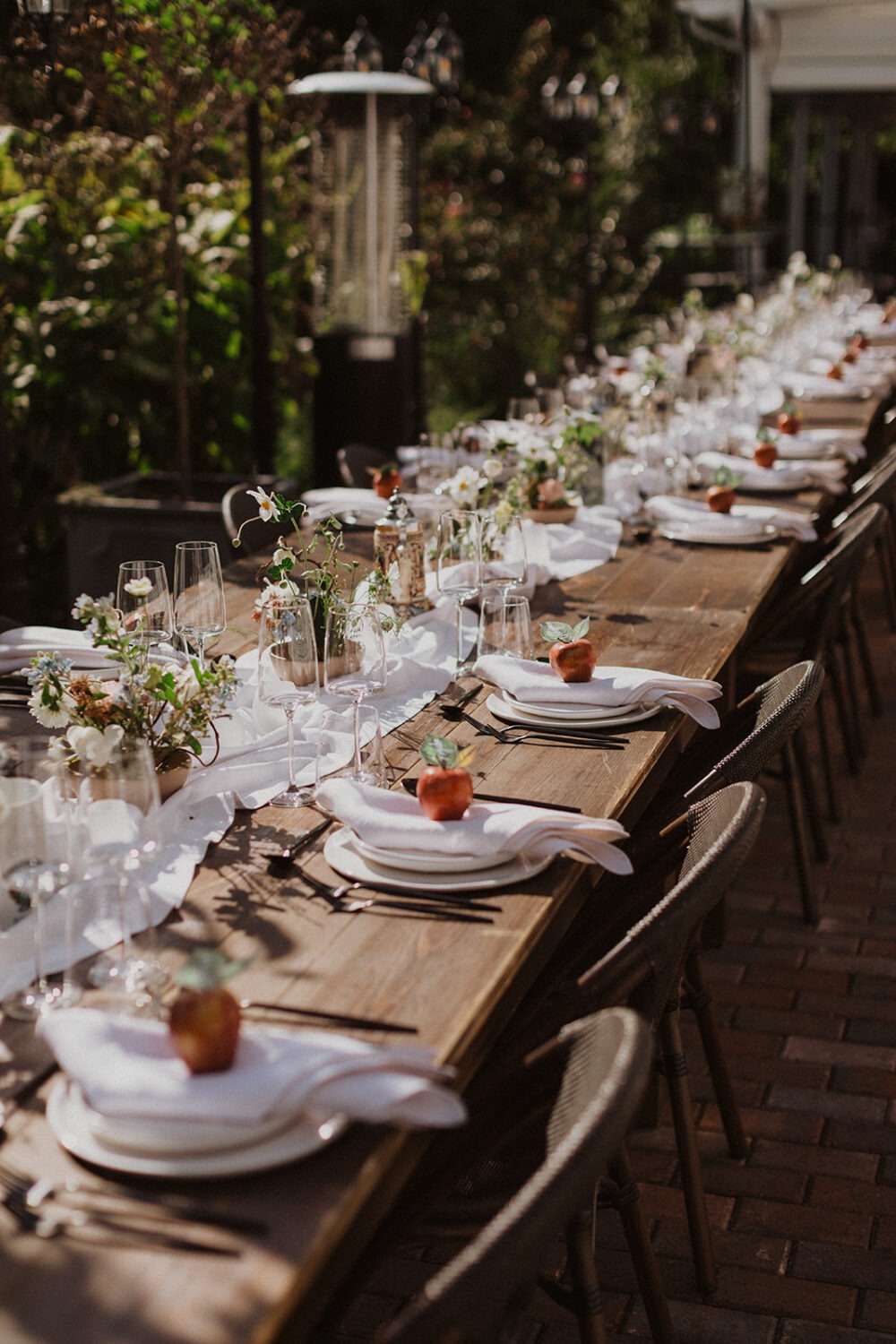 white plates and linens at outdoor wedding 