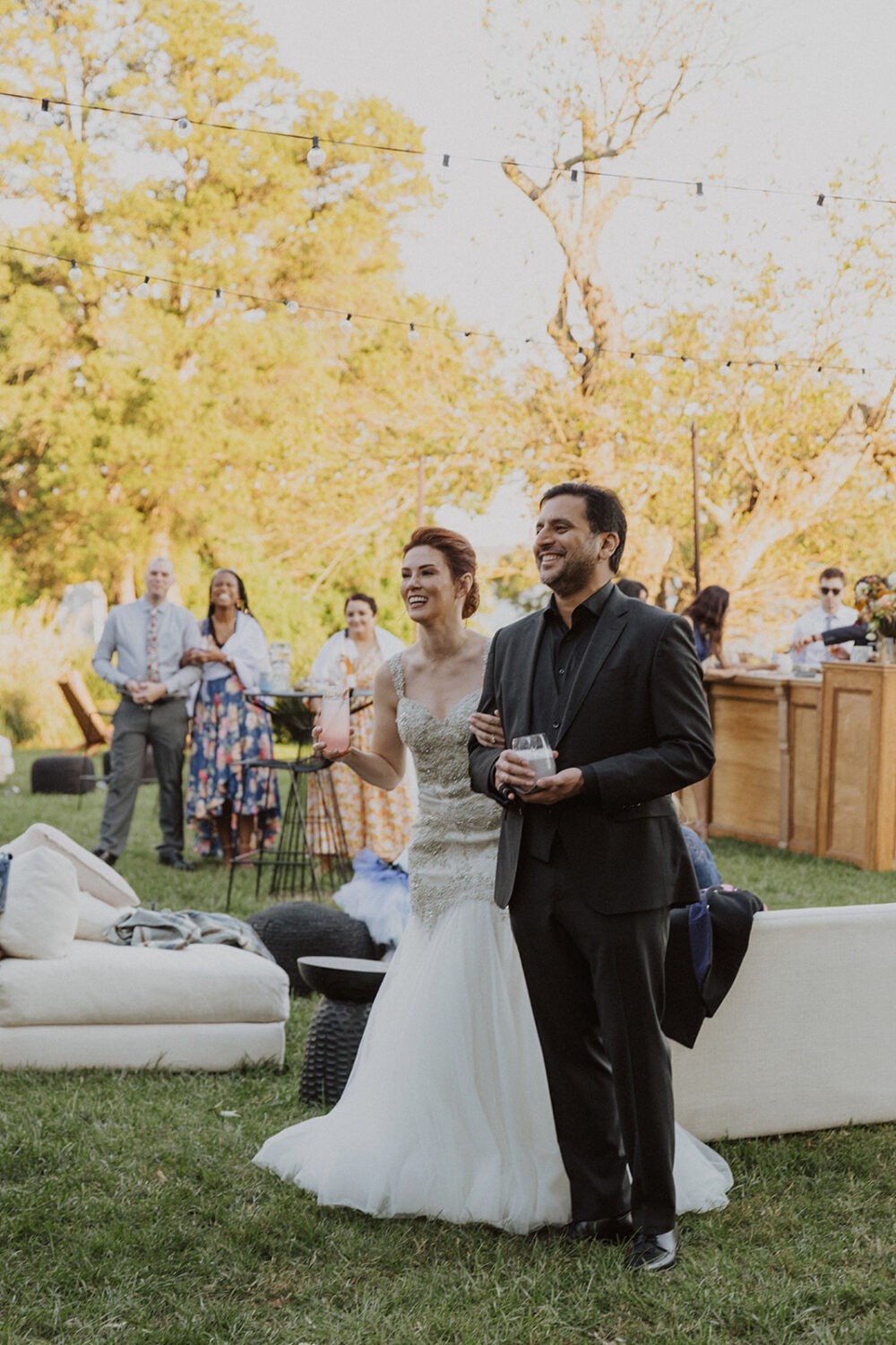 couple laughs during speeches at outdoor Virginia wedding venue
