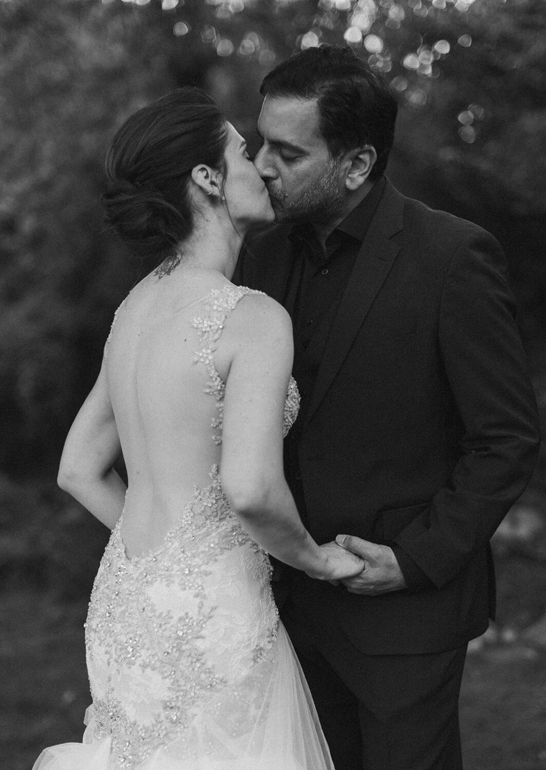 couple kisses at outdoor Virginia wedding venue