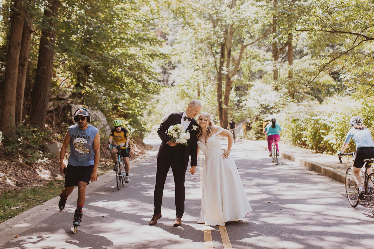 couple embraces in forest for outdoor wedding 
