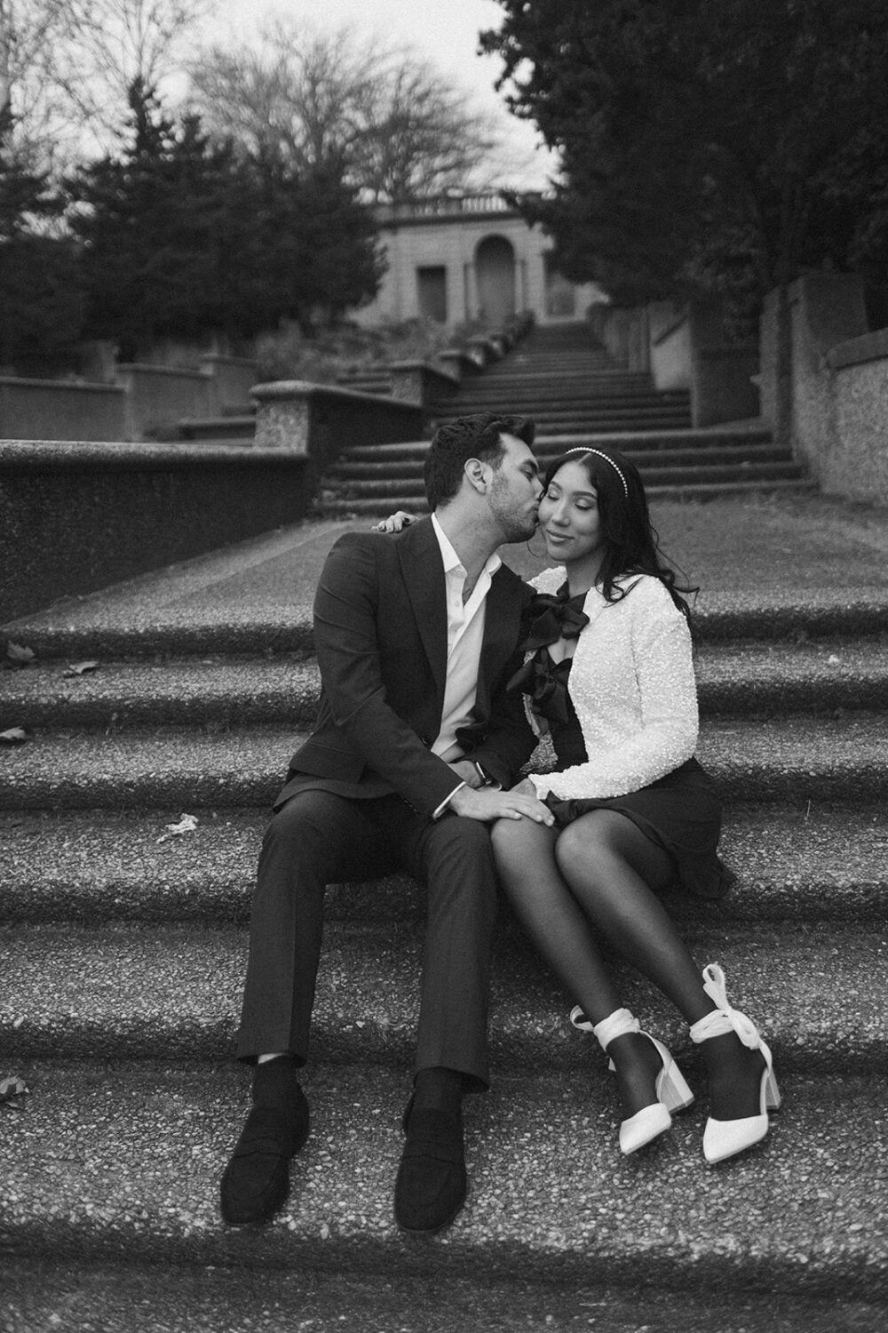 couple kisses at Meridian Park engagement session 