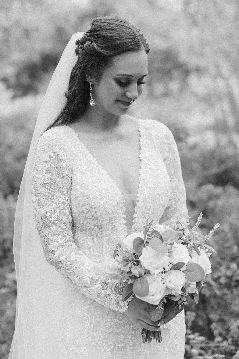 bride holds wedding flower bouqeut 