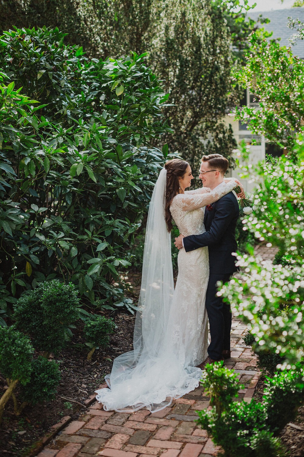 couple kisses at garden wedding venue in Washington DC