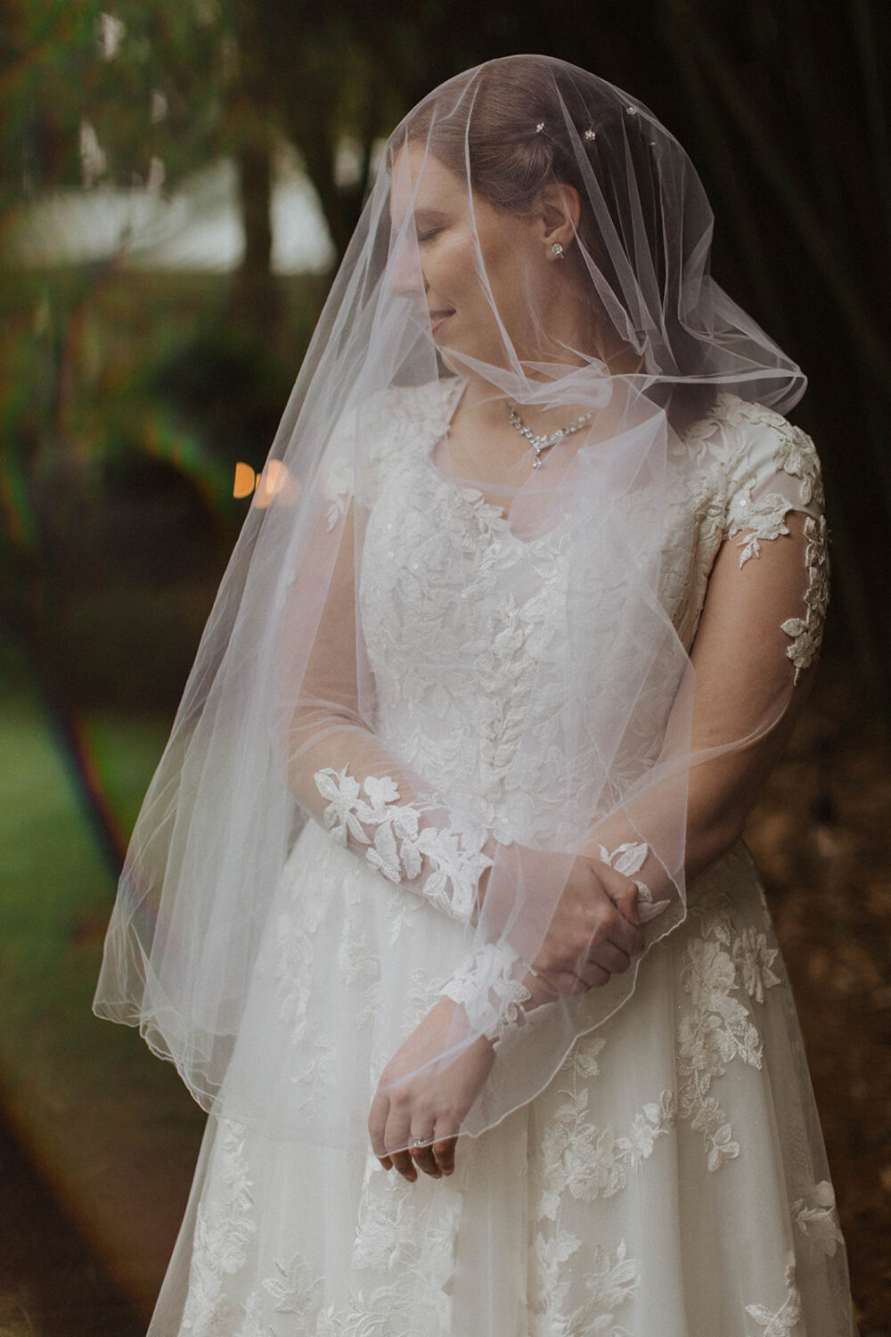 bride wears veil during bridal portraits