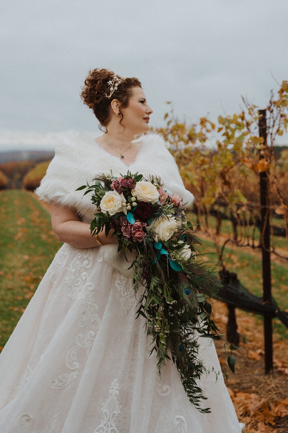 bride holds wildflower wedding bouquet 