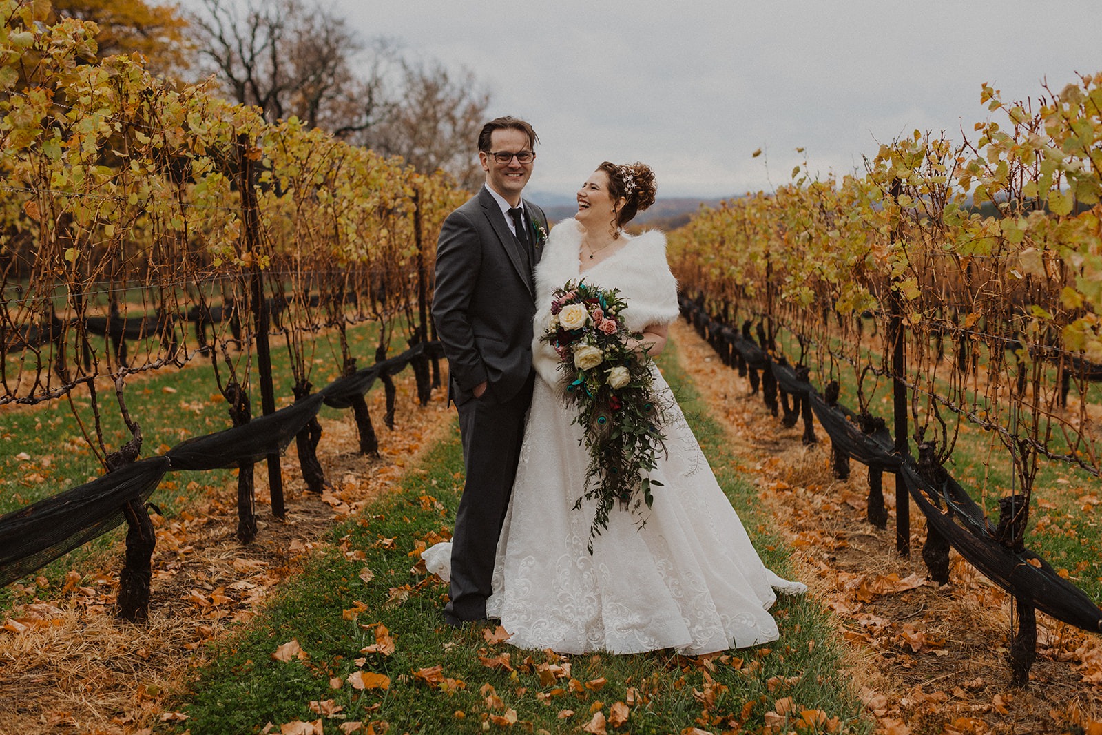 couple embraces at vineyard wedding