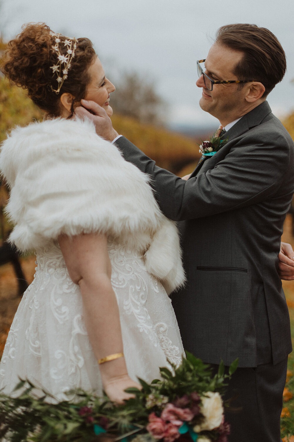 couple kisses at outdoor fall wedding 