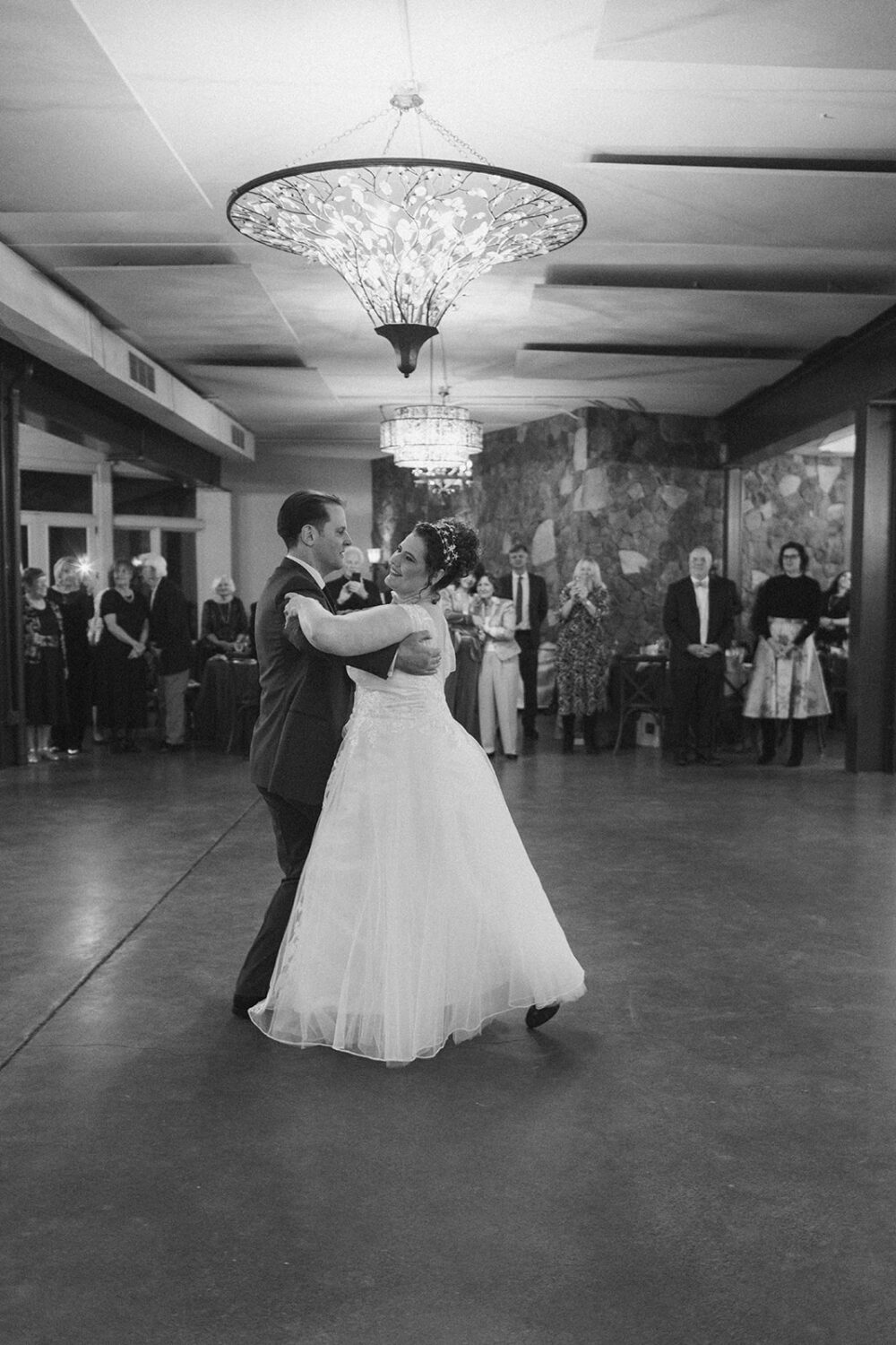couple has first dance together at wedding reception 