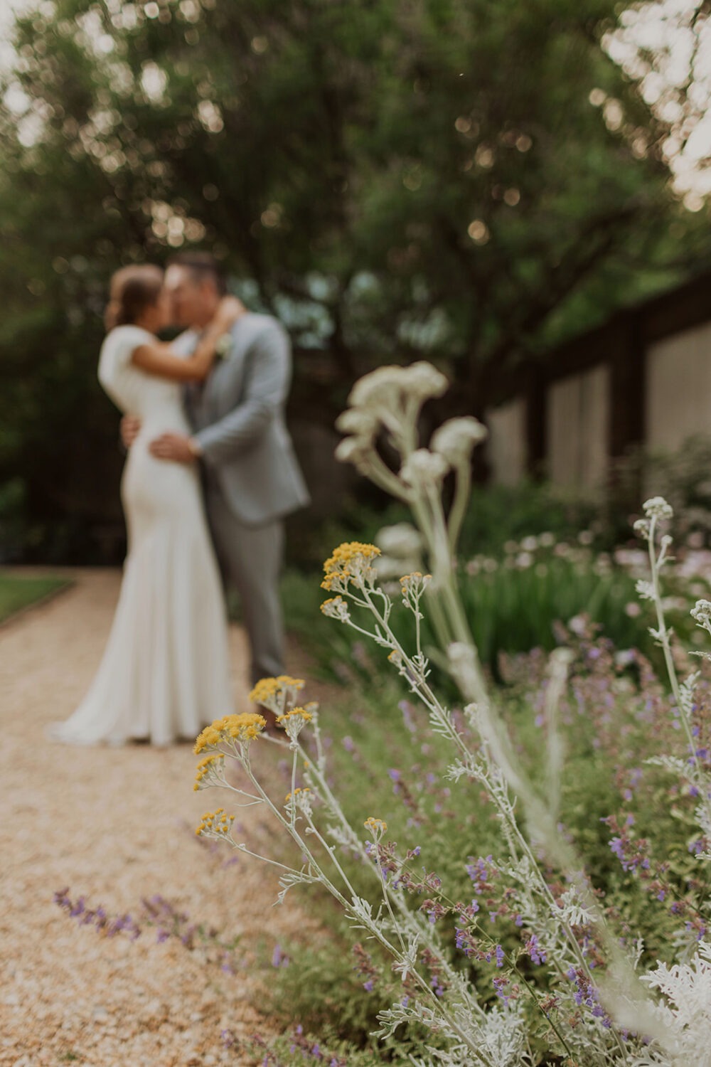 couple kisses in garden at Dumbarton House wedding 