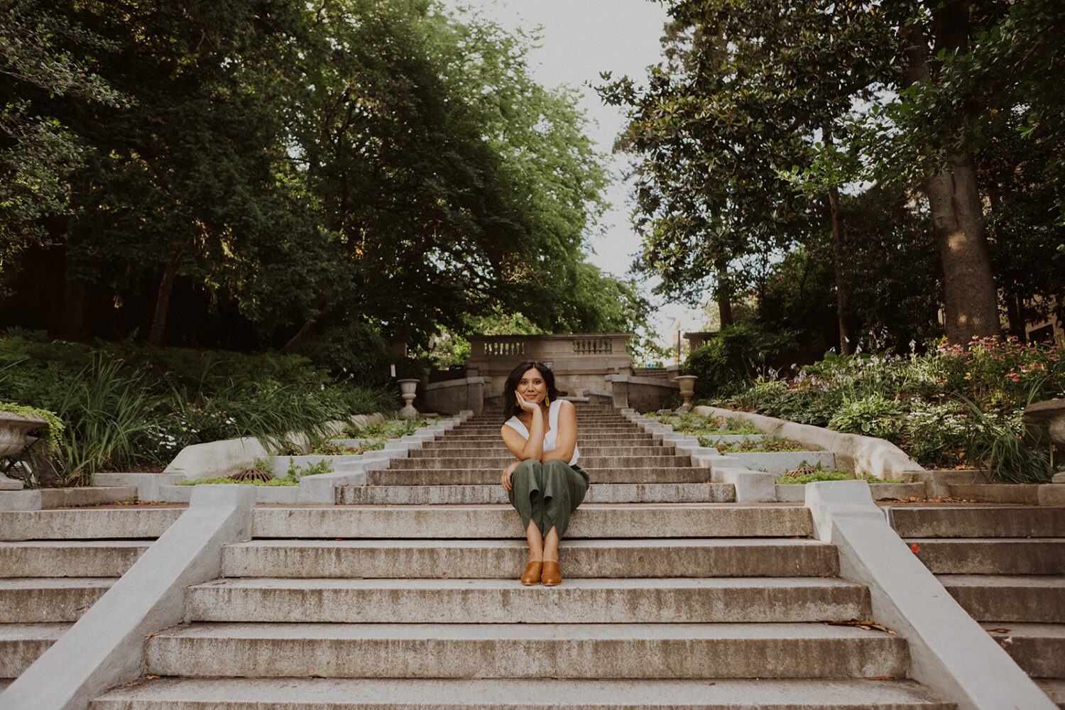 woman sits on Spanish steps for Meridian Hill Park headshots
