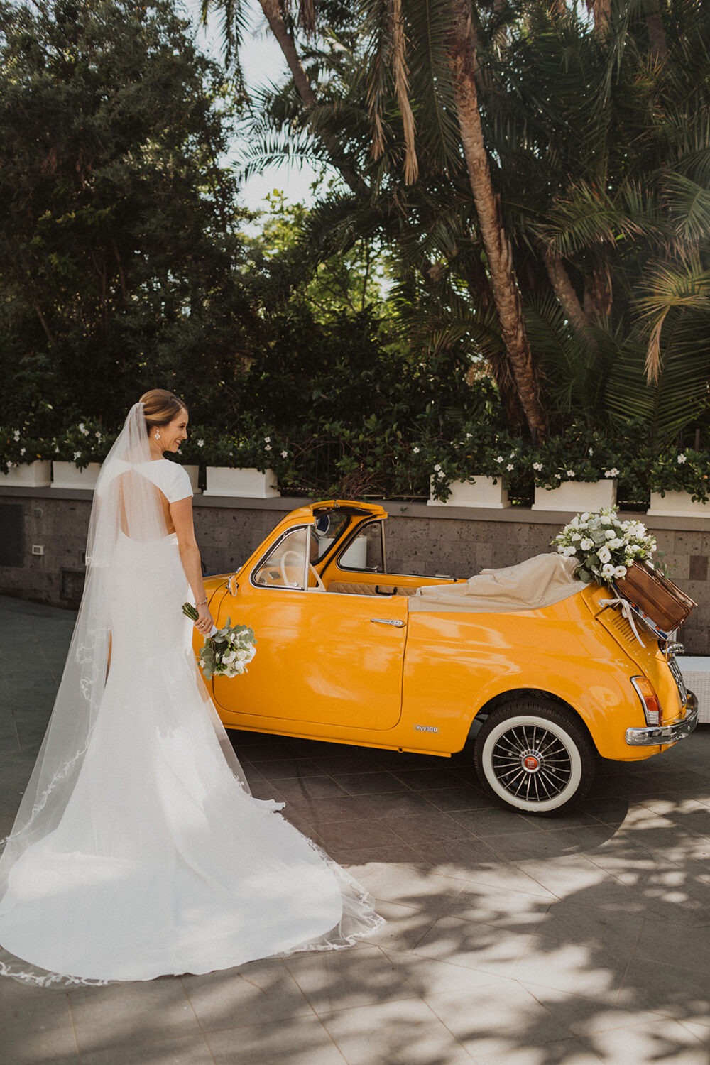 bride takes bridal portraits as part of photography wedding package