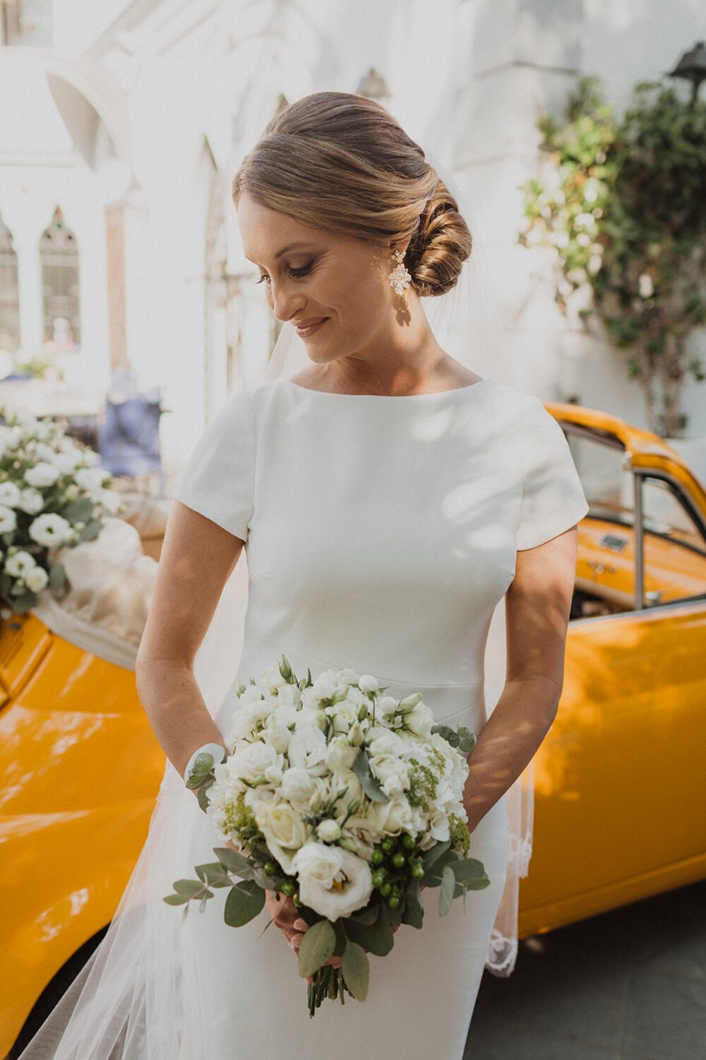 bride takes bridal portraits as part of photography wedding package