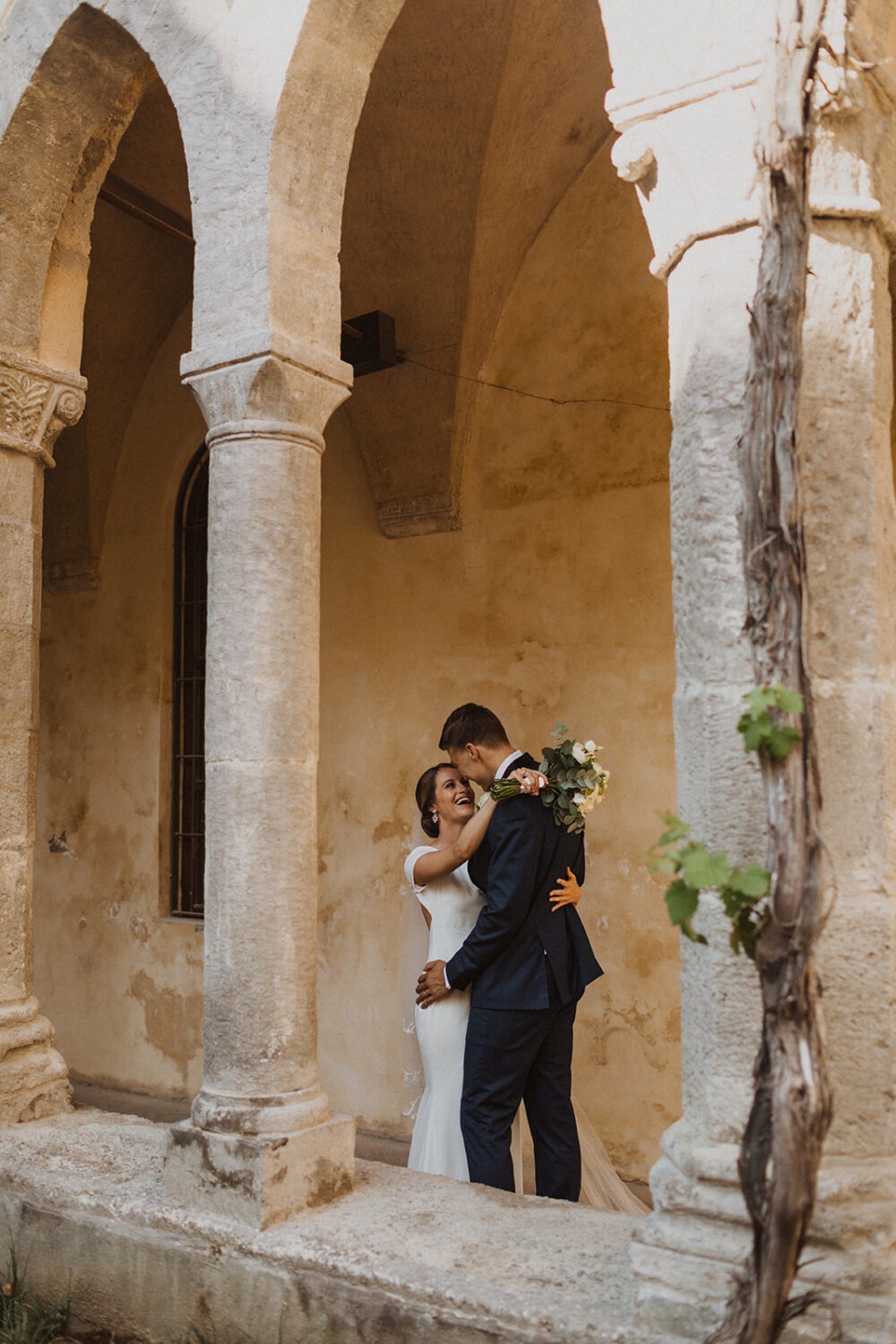 couple embraces at Italy destination wedding 