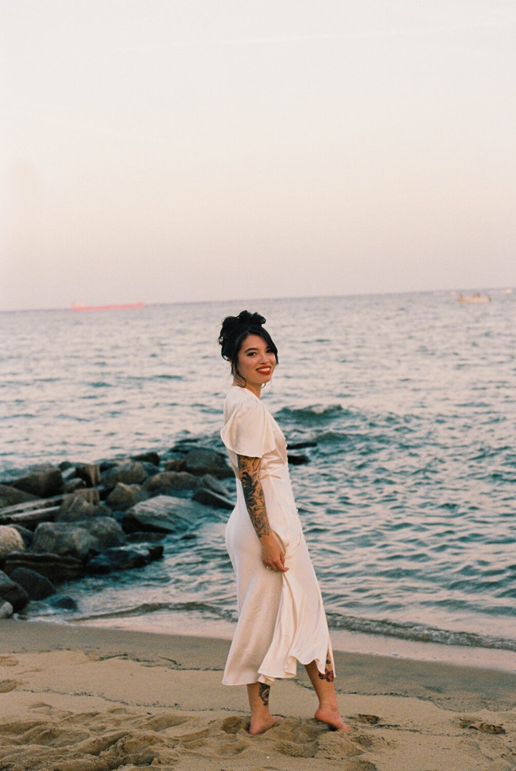 bride poses for portraits as part of photography wedding package